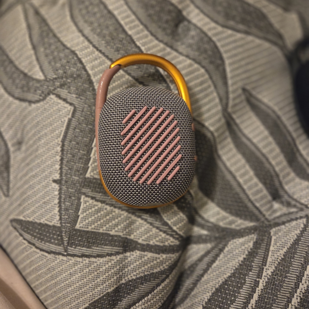 Compact Bluetooth Speaker with Gold and Pink Design